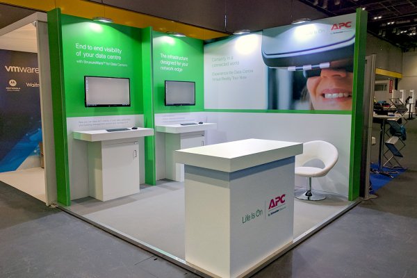 Custom exhibition stand with mounted screens at the NEC Birmingham